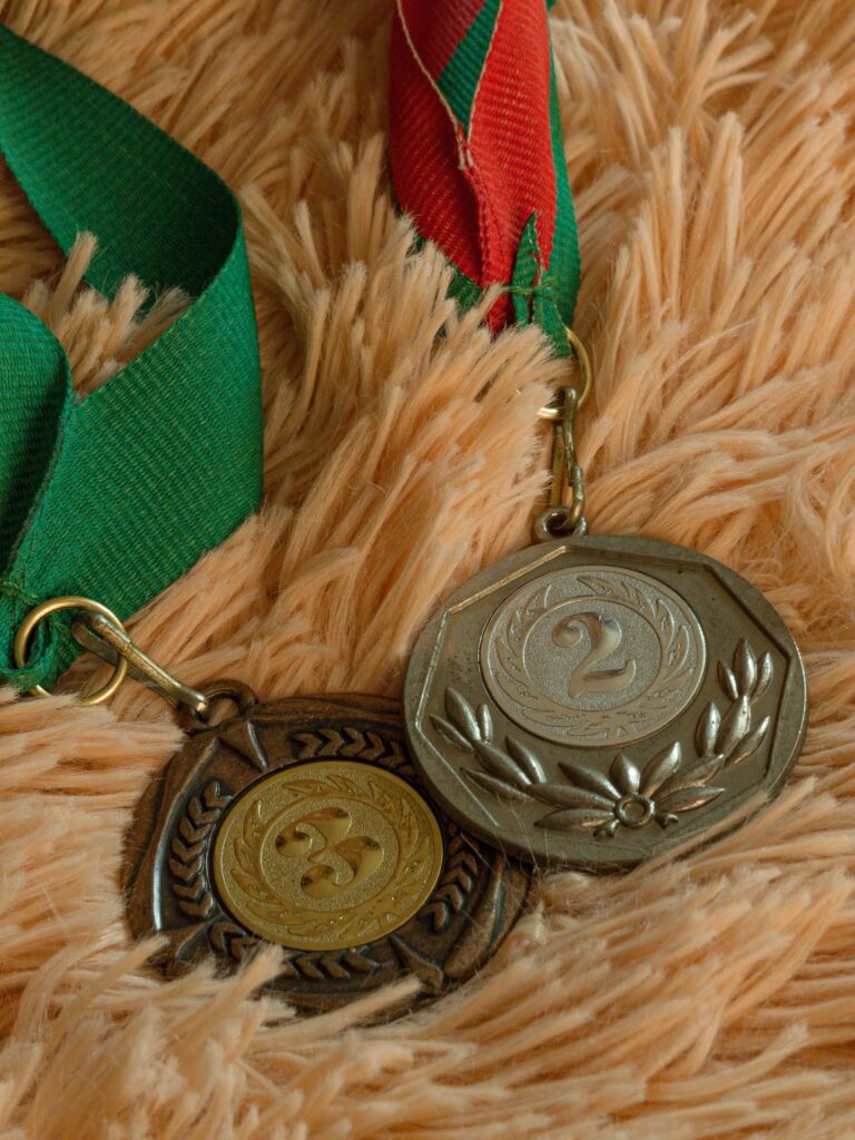 Custom sports medals with gold, silver and bronze plating manufactured by Differento International